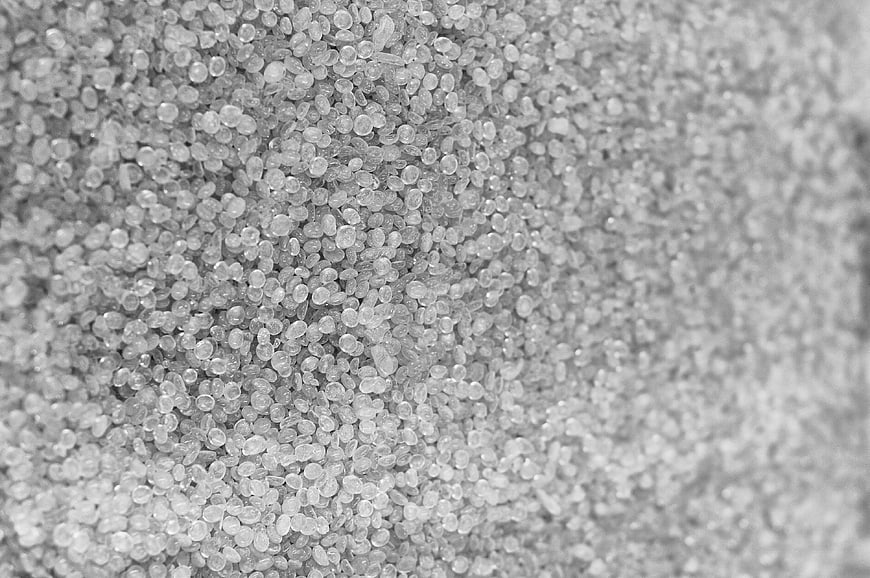 Close-up of white plastic pellets texture background