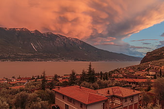 Dramatic sunset over Italian lake and mountains