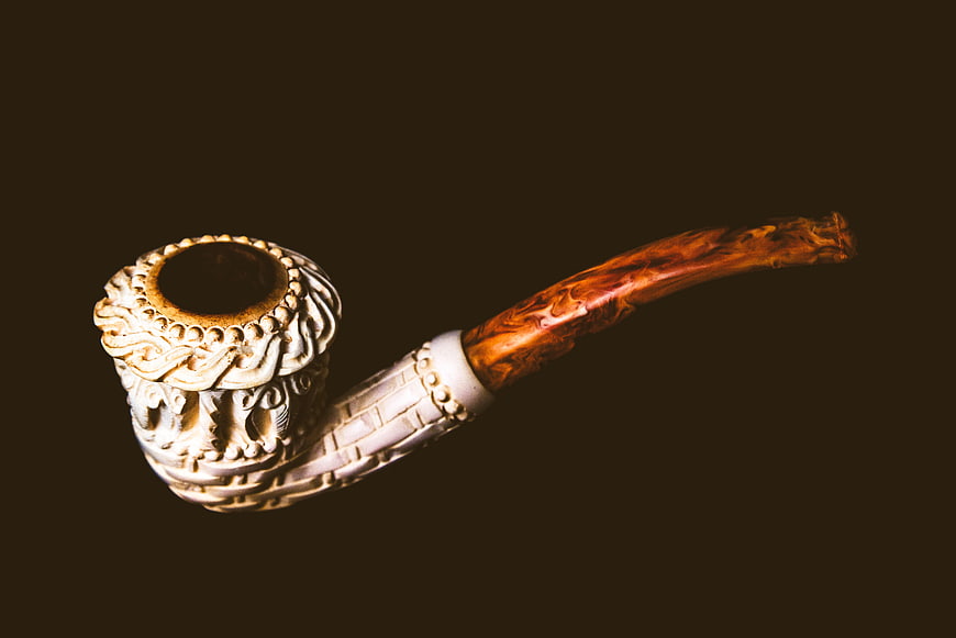 Vintage Carved Wooden Pipe on Dark Background