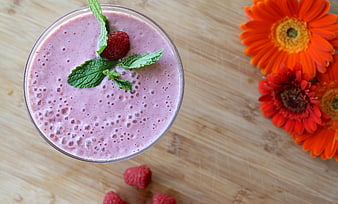 Top View of Raspberry Smoothie with Mint and Flowers