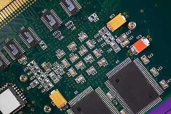 Close-up of green circuit board with electronic components
