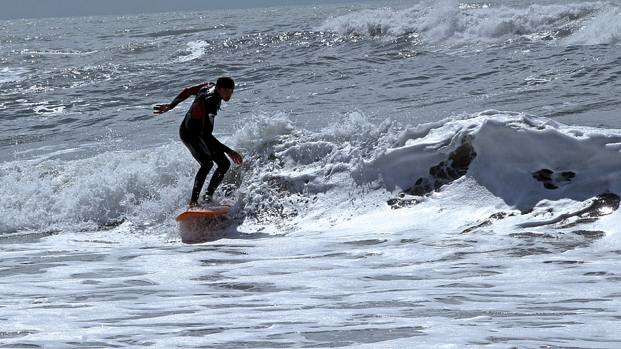 Surfer riding a wave in the ocean