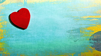 Red Heart on Textured Blue and Yellow Background