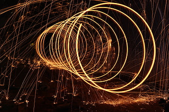 Steel Wool Photography: Glowing Orange Light Painting Spirals at Night