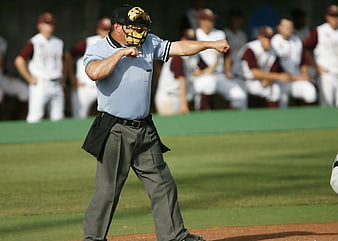 Baseball Umpire Making Strike Call on Field