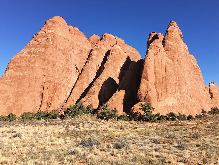 Red Rock Formations in Desert Landscape Under Blue Sky