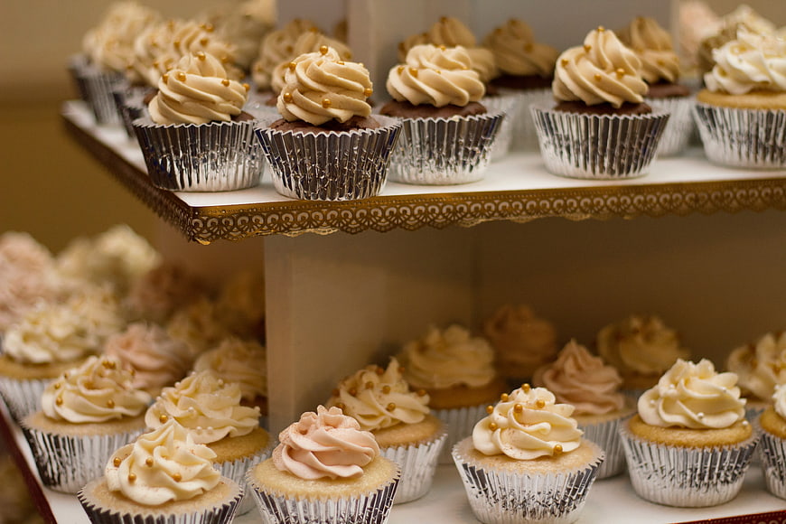 Tiered Cupcake Display with Swirled Frosting and Gold Sprinkles