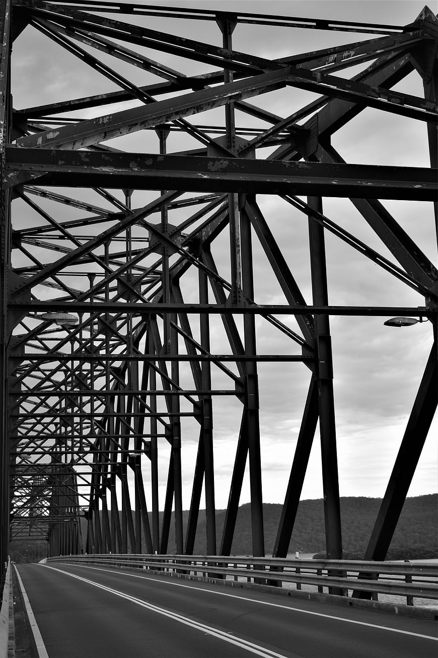 Black and white steel truss bridge architecture perspective