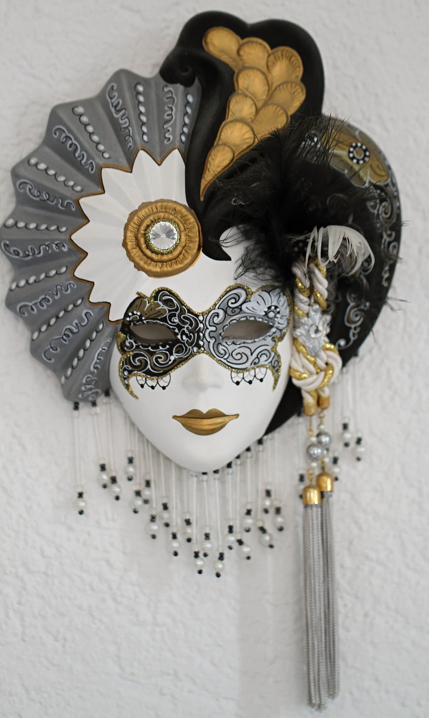 Ornate Venetian Carnival Mask With Gold, Black, And White Feathers