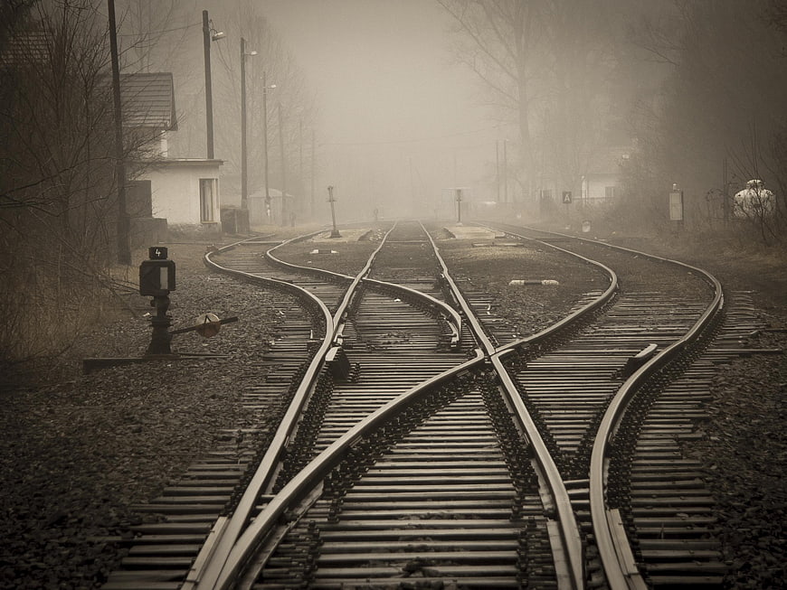 Foggy Railway Tracks with Switches and Signal