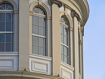 Classical curved building facade with arched windows