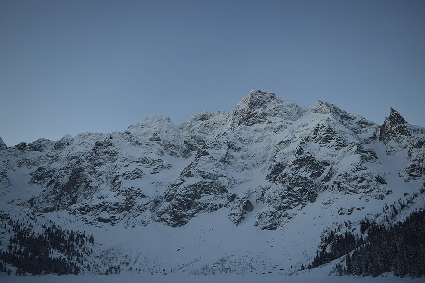 Snow-Covered Mountain Peaks at Dusk