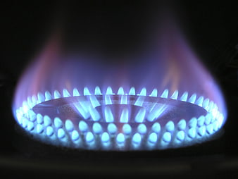 Close-up of blue gas stove burner flame