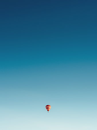 Minimalist Hot Air Balloon in Blue Gradient Sky