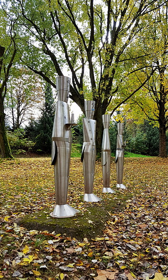 Stainless steel abstract sculptures in autumn park