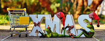Christmas Shopping Concept with Frogs and Trolley