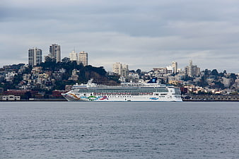 Cruise ship sailing past San Francisco city skyline