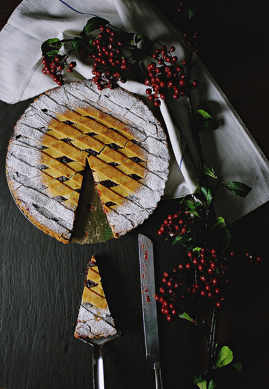 Top View of Lattice Pie with Red Berries and Knife