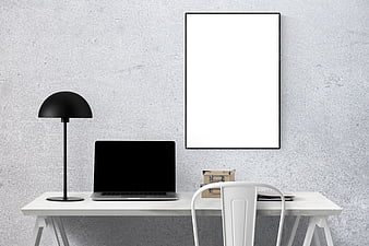 Minimalist White Office Desk with Laptop and Blank Poster Frame