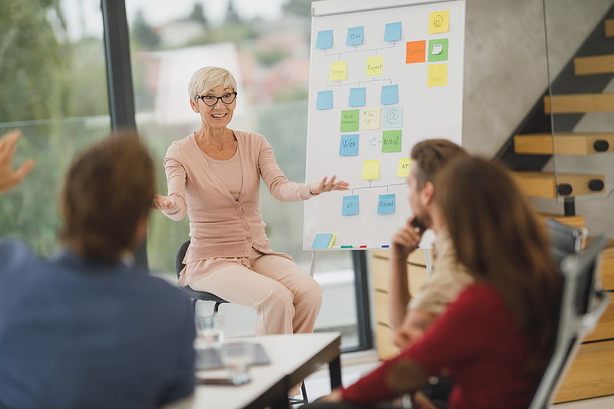 Senior female business leader leading a strategy meeting