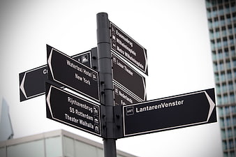 Black directional street signs in Rotterdam, Netherlands