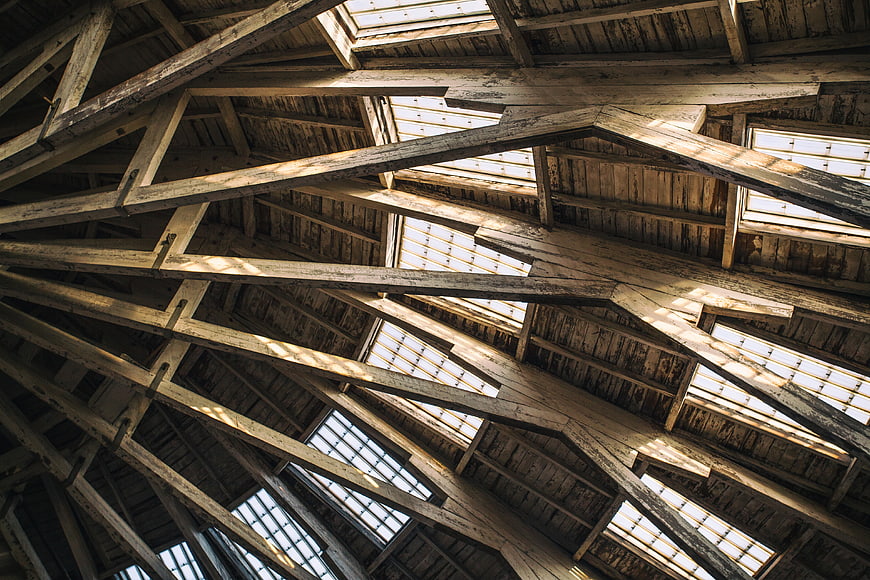 Rustic wooden roof beams with skylights