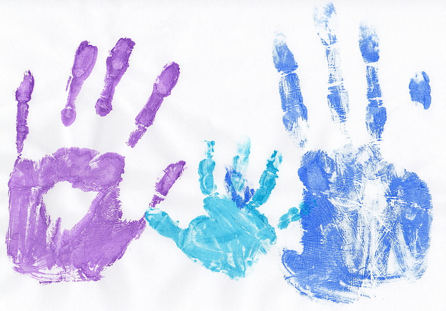 Colorful Painted Handprints On White Paper Background