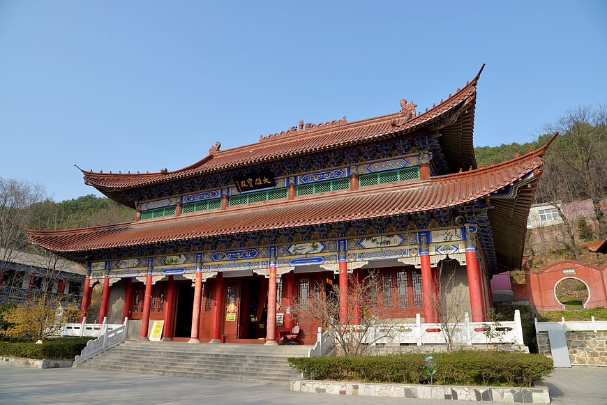 Traditional Chinese Temple with Red Pillars and Blue Roof