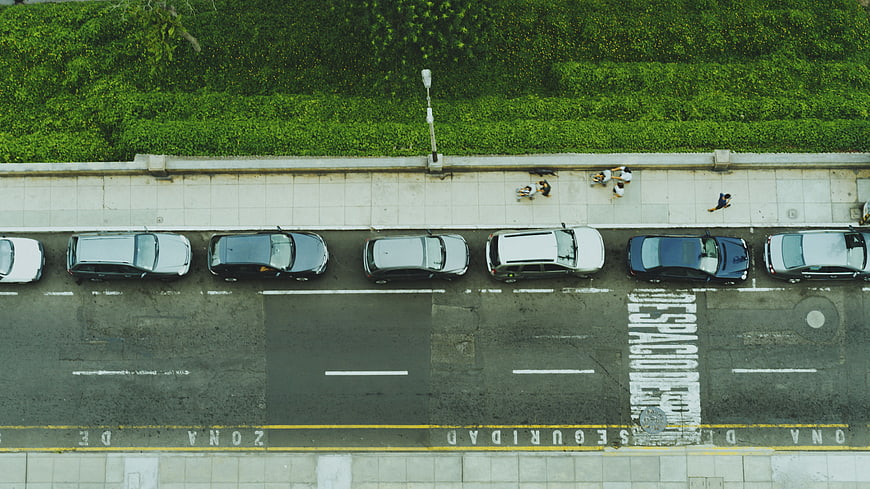 Aerial View of Parked Cars and Pedestrians on City Street