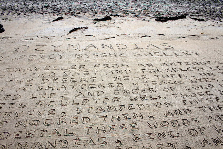 Ozymandias poem text written in sand on beach