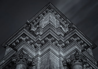 Low angle black and white architectural detail of classical building