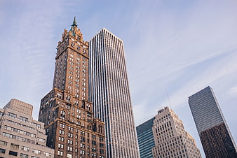 Low angle view of historic and modern skyscrapers in downtown city