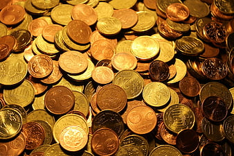 Pile of Euro Coins with Golden Lighting