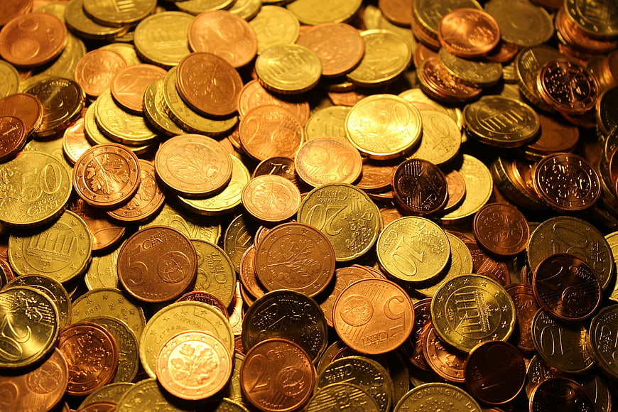 Pile of Euro Coins with Golden Lighting