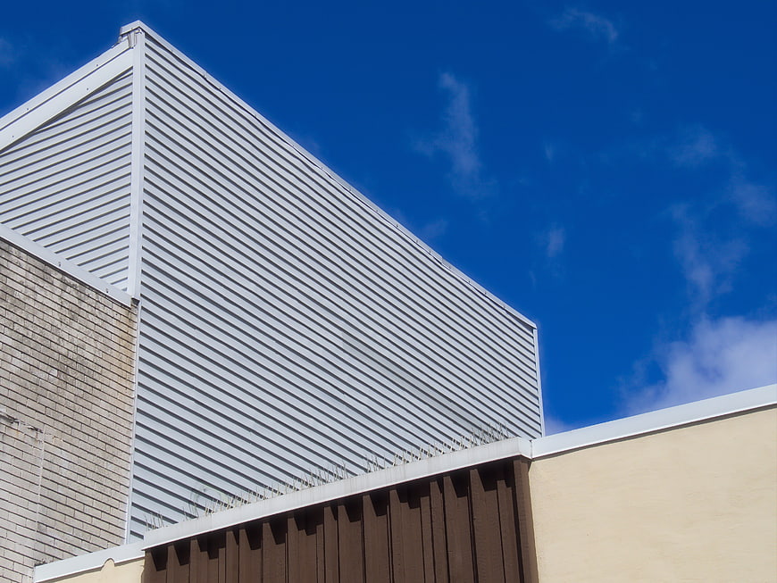 Modern Industrial Building Facade Against Blue Sky