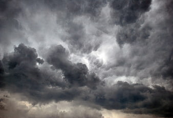 Dramatic Dark Storm Clouds With Sunlight Breaking Through
