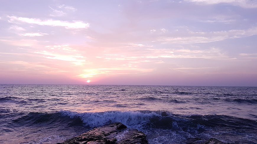 Serene Ocean Sunset with Purple and Pink Sky