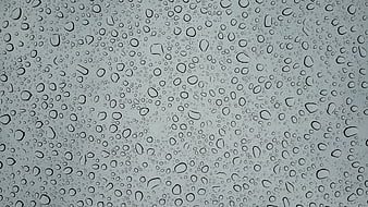 Raindrops on Glass Window Texture Background