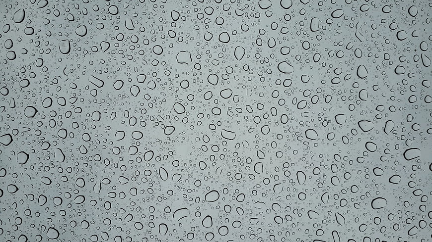 Raindrops on Glass Window Texture Background
