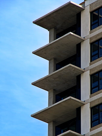 Modern Concrete Balconies Against Blue Sky