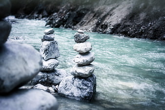Stacked Zen Stones Balanced on River Rocks