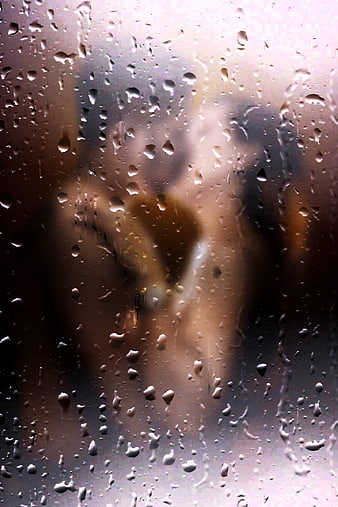 Romantic Couple Silhouette Behind Rainy Window