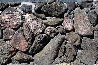 Rough volcanic stone wall texture background
