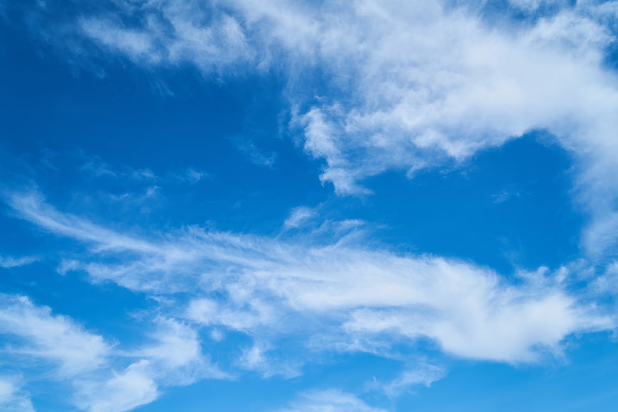 Vibrant Blue Sky With Wispy White Cirrus Clouds