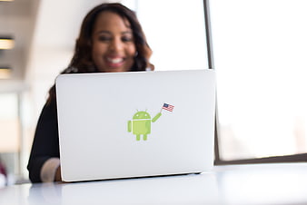 Woman with Android Sticker on Laptop in Office