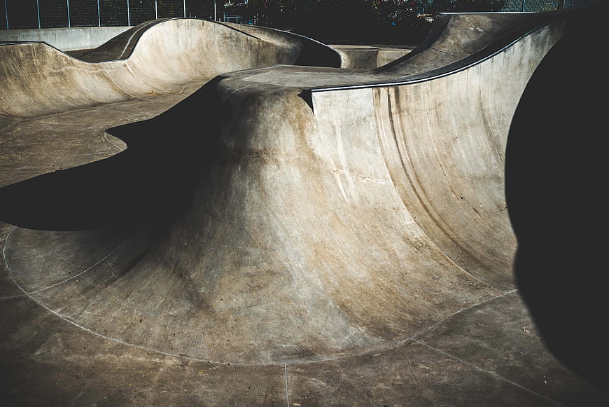 Empty Concrete Skatepark Bowl at Night