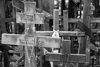 Grayscale Wooden Crosses with Prayer Beads and Inscriptions