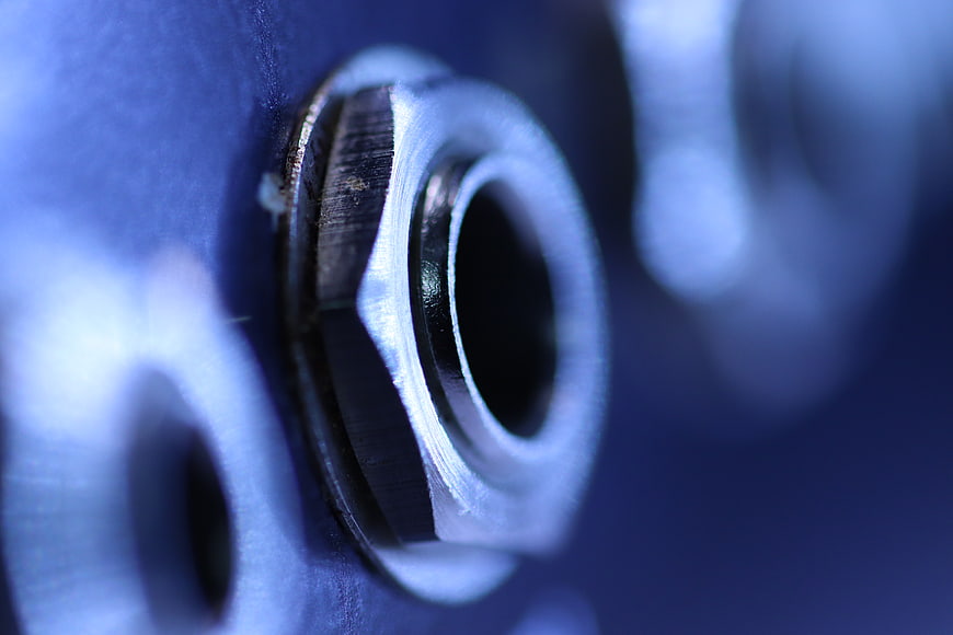 Close-up of blue electric guitar input jack