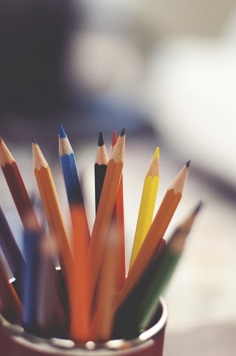 Close-up of colorful pencils in a cup