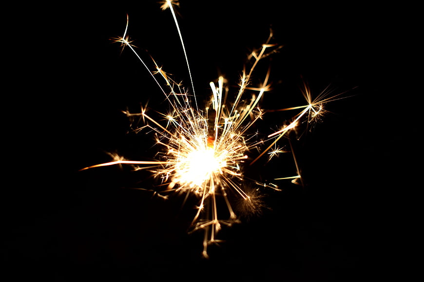 Sparkler Burning Bright Against Black Background